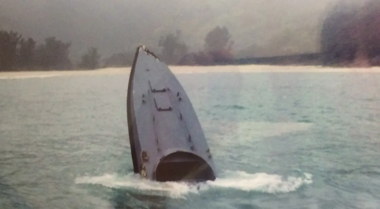 A sinking daai fei, after a high-speed chase and collision.