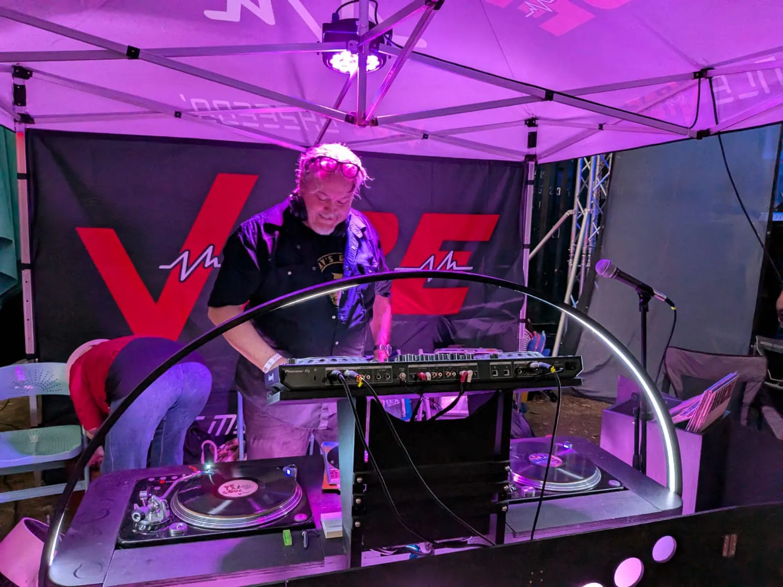 Jarrod DJing under purple lights
