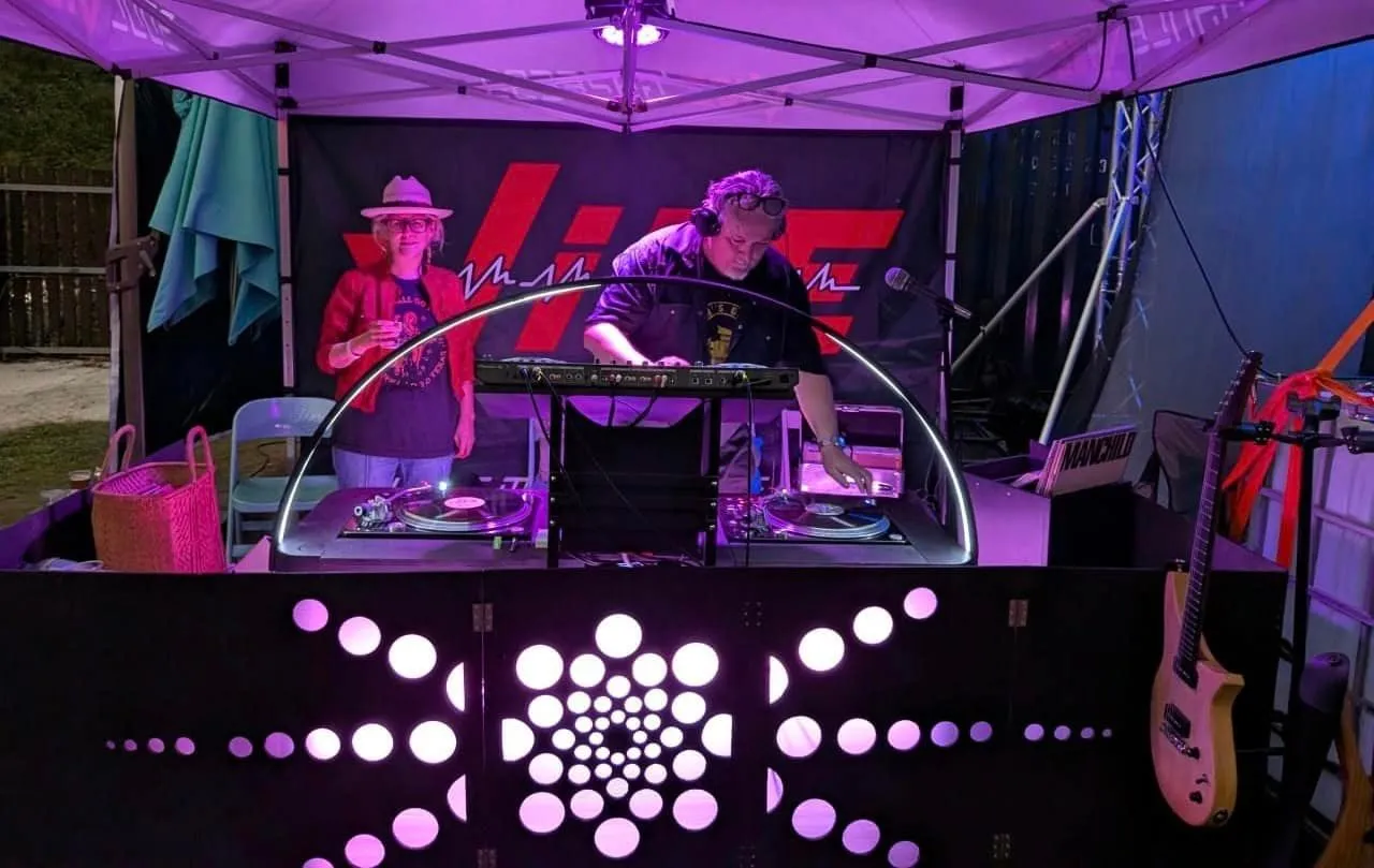 Jarrod and Robin in the VIBE Alive tent after dark